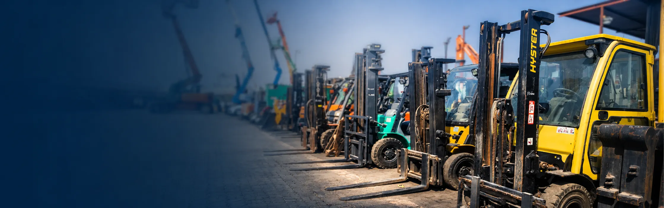 Fleet of forklifts lined up in the HYLIFT rental yard