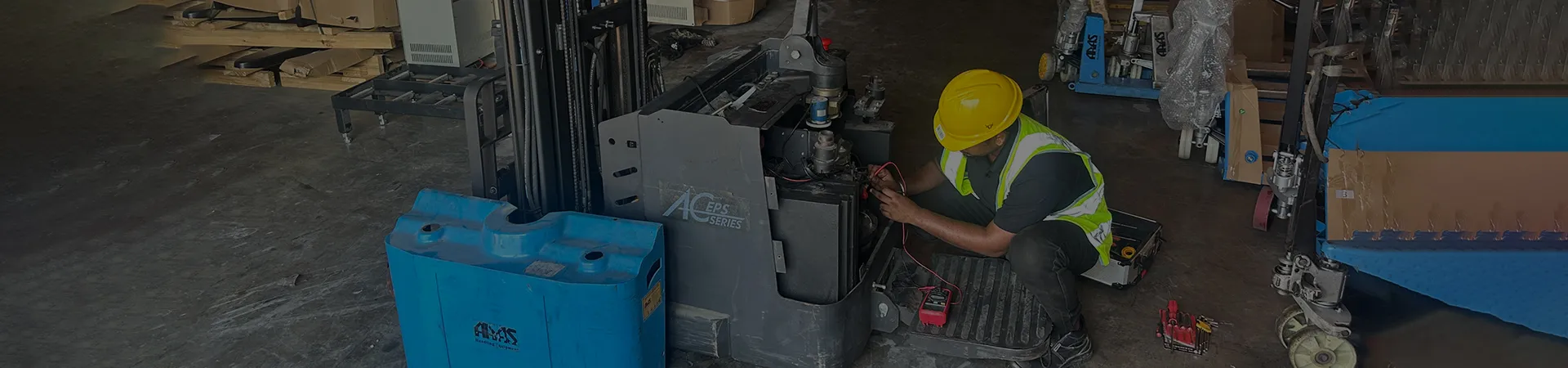 HYLIFT engineer repairing material handling equipment
